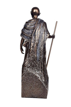 Resin Gandhi showpiece, back view with draped cloth and raised staff
