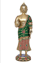 Standing Buddha statue, brass gold finish, green robe with red patterning, jeweled blue base
