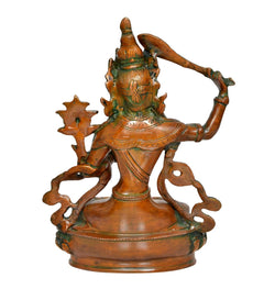 Brass Tara Devi statue, rear view with draped ornaments and raised arm