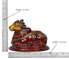 Nandi bull statue (Height 6 in, Width 7.5 in), dark brown with gold-toned face details