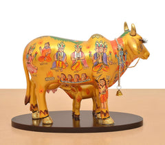 Resin Kamdhenu cow and calf with patterned back, hanging chain bell accessory.