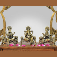 Brass idol trio of Ganesha, Lakshmi, Saraswati on singhasan, 4-inch height