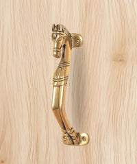 Brass horse-shaped door handle with curved lever and round fixing points