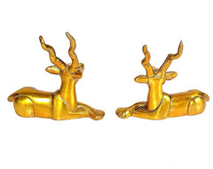 Par de ciervos dorados en bronce, figuras sentadas, vista lateral de las patas