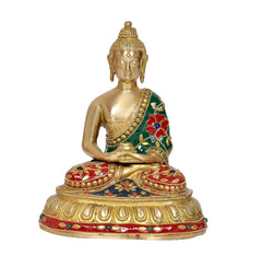 Buddha-Idol im Lotussitz, goldfarbener Körper, grün-rotes Patchwork-Gewand mit Perlen