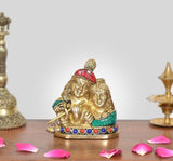 Brass Radha Krishna statue, seated couple with red headpiece and blue beaded base