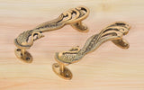 Peacock ornament brass door handle pair, top curved pulls with oval end plates
