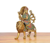 Brass Durga Maa on lion idol, right-side view, gold finish with teal-red accents