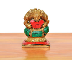 Rear view of brass Panchmukhi Ganesha sitting murti with red and green torso