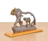 Gray resin elephant and baby elephant figurine, side view on gold base