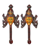 Brass Buddha-face door handles, pair view with ornate flared sides
