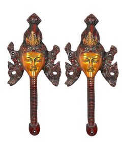 Brass Buddha-face door handles, pair view with ornate flared sides