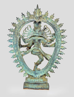 Bronze Shiva Nataraj back view, dancing legs and arms, spiked halo arch, blue-green patina