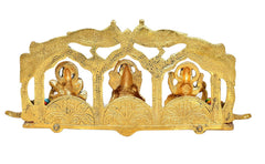 Peacock frame metal idol back view with three small deity figures in gold tone