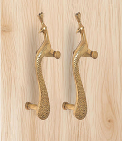 Brass peacock door handle pair viewed from side, showing pins and curved grip shape