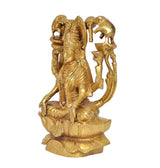 Brass Lakshmi idol seated on lotus, three-quarter view, elephant trunk arms and crown