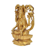 Brass Lakshmi idol seated on lotus, three-quarter view, elephant trunk arms and crown