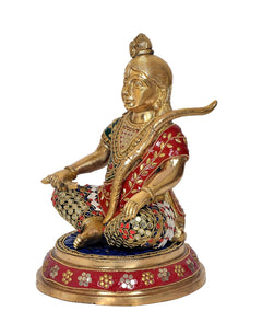 Ram Lalla sitting brass idol, side profile with ornate red drape and studded details