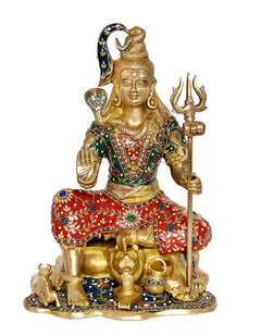 Seated brass Shiva sculpture with trident, red and green embroidered robe with beads