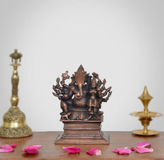 Copper Ganesha statue seated with Riddhi, decorative small deity idol, front view