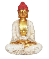 Buddha-Statue im Lotussitz, roter Kopf mit goldenen Augen, weiße Robe mit Gold