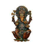 Front view of Lord Ganesha brass statue, seated on lotus base with detailed jewelry