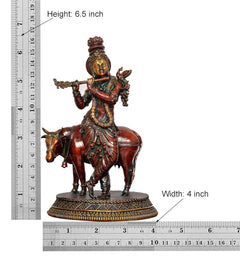 Superfine brass Krishna idol on cow with measurements shown: height 6.5 in, width 4 in