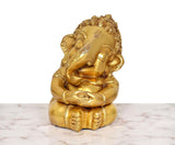 Brass Bal Ganesha murti, front view, seated posture with ornate crown and ornaments