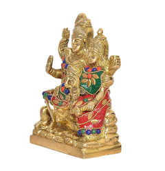 Brass Shiv Parivar murti (5 inch), angled view: gold-toned Shiva family with red and green accents