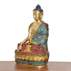 Messing-Buddha im Meditationssitz, seitliche Ansicht, türkis/rot verzierte Gewänder