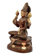 Lakshmi goddess statue side view, seated cross-legged with lotus base ornaments