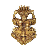 Brass Kirtimukha face wall ornament, symmetrical eyes and ornate headdress