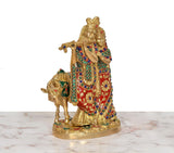 Back/side view of Radha-Krishna brass idol with cow, multicolored adornments