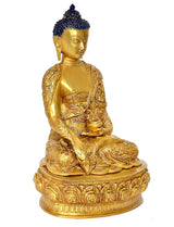 Front view Buddha idol statue in gold tone with blue jeweled crown and carved pedestal