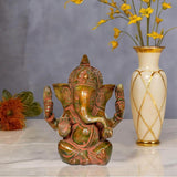 Brass Ganesha idol statue, seated four-armed figure with decorative face and ornaments