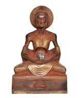 Brass emaciated Buddha statue, seated posture with halo and centered face; 9-inch.