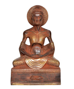 Brass emaciated Buddha statue, seated posture with halo and centered face; 9-inch.