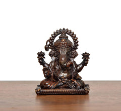 Sitting Ganesha brass idol, front view, detailed face and jeweled headpiece