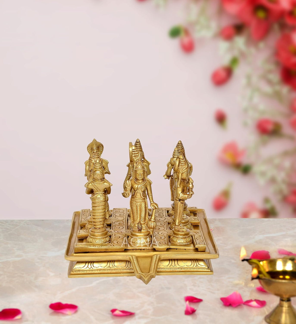 Brass Navagraha statue set with nine planetary deity figures on engraved base
