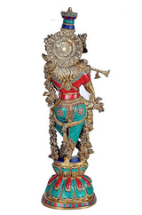 Brass Radha Krishna sculpture, side view of golden figure wearing red and teal outfit