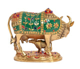 Brass Kamdhenu cow with calf, teal-green panels with gold studs and jeweled border