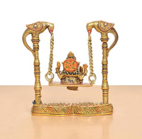 Ganesha swing statue rear view with decorated base and chain-holding posts