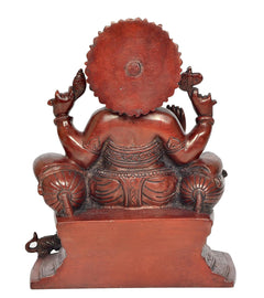 Back view of seated Lord Ganesha brass idol, maroon-bronze finish with detailed back panel