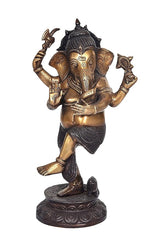 Standing brass Ganesha figurine, four hands raised, dark textured garments and crown