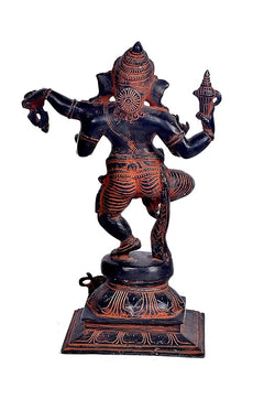 Dancing Ganesha idol, angled back view with four arms, dark blue base and red accents, 12 in
