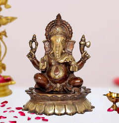 Brown brass Ganesha lord sculpture with four arms, seated on ornate base