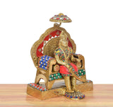 3-4 view brass Agrasen idol with red halo, gold elephant, jeweled saddle