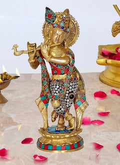 Krishna statue idol in brass with colorful gemstone inlay, standing on decorated base