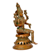 Lakshmi statue back/side view, seated with raised lamps and detailed crown, brass-tone