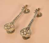 Sitar-shaped brass handles, pair with detailed teardrop ends and stacked groove bands.